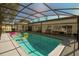 Spacious screened-in pool area with patio furniture and a clear, inviting pool at 1529 Glastonberry Rd, Maitland, FL 32751