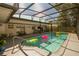 Inviting pool area with a large screened enclosure, patio furniture, and clear water at 1529 Glastonberry Rd, Maitland, FL 32751