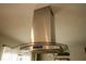 Close up of stainless steel range hood in modern kitchen at 1529 Glastonberry Rd, Maitland, FL 32751