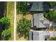 Aerial view shows the home's roof, lawn, and proximity to the lake with walkway at 1645 Boulder Creek Ct, Apopka, FL 32712