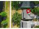 Aerial view shows the home's roof, lawn, and proximity to the lake with walkway at 1645 Boulder Creek Ct, Apopka, FL 32712