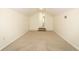 A bright attic space with carpeted floors and painted white walls; a doorway leads to another room at 1645 Boulder Creek Ct, Apopka, FL 32712