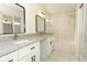 Elegant bathroom with dual sinks, granite countertops, shower, and bathtub at 1645 Boulder Creek Ct, Apopka, FL 32712