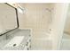 Bathroom featuring granite countertop vanity, bathtub with shower, and tiled walls at 1645 Boulder Creek Ct, Apopka, FL 32712