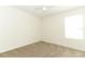 An airy bedroom with carpet, a ceiling fan, and natural light from the window at 1645 Boulder Creek Ct, Apopka, FL 32712
