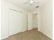 Cozy bedroom with carpet, a ceiling fan, a closet, and an adjoining room at 1645 Boulder Creek Ct, Apopka, FL 32712