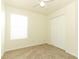 Bright bedroom featuring a ceiling fan, neutral carpet, and a window at 1645 Boulder Creek Ct, Apopka, FL 32712