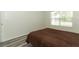Bedroom with a large bed and wood floors at 1645 Boulder Creek Ct, Apopka, FL 32712