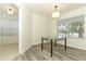 Bright dining room featuring wood floors and a glass table with a view from a large window at 1645 Boulder Creek Ct, Apopka, FL 32712