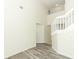 Bright foyer featuring wood-look floors, high ceilings and a staircase leading upstairs at 1645 Boulder Creek Ct, Apopka, FL 32712