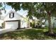 Charming two-story home with a well-maintained lawn and a walkway leading to the front door at 1645 Boulder Creek Ct, Apopka, FL 32712