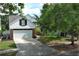 Picture of the front exterior of a two-story home with a two-car garage and a well-manicured front lawn at 1645 Boulder Creek Ct, Apopka, FL 32712