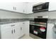 Bright kitchen featuring stainless steel appliances and granite countertops at 1645 Boulder Creek Ct, Apopka, FL 32712
