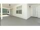 Covered patio with painted floor and siding; access through a sliding glass door and a single door at 1645 Boulder Creek Ct, Apopka, FL 32712