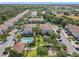 Aerial view of a community featuring townhouses, a pool, a playground, and manicured landscaping at 1772 Garden Sage Dr, Oviedo, FL 32765