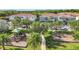 Aerial view of colorful townhouse community featuring playgrounds and well maintained landscaping at 1772 Garden Sage Dr, Oviedo, FL 32765
