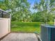 Well-maintained backyard with lush green grass and trees at 1772 Garden Sage Dr, Oviedo, FL 32765