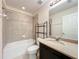 Bathroom with a single sink vanity and a shower-tub combo at 1772 Garden Sage Dr, Oviedo, FL 32765