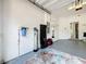 Attached garage showing water filtration system at 1772 Garden Sage Dr, Oviedo, FL 32765