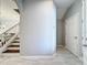 Hallway view showing the stairs to the second floor, hall closet and front door at 1772 Garden Sage Dr, Oviedo, FL 32765
