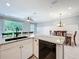 Bright kitchen with island, marble counters, stainless steel appliances, and an open floor plan at 1772 Garden Sage Dr, Oviedo, FL 32765