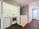 Spacious laundry room with a side by side washer and dryer and shelving at 1772 Garden Sage Dr, Oviedo, FL 32765