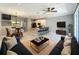 Open-concept living room features a kitchen island, dining area, and comfortable seating area at 1772 Garden Sage Dr, Oviedo, FL 32765