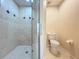The bathroom has a tiled walk-in shower with glass door at 1772 Garden Sage Dr, Oviedo, FL 32765