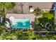 Aerial view of the backyard featuring a pool, patio, garden area and lush green lawn at 2105 Fosgate Dr, Winter Park, FL 32789