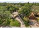 Aerial view of the home showing the meticulously kept landscaping, long driveway, and mature trees at 2105 Fosgate Dr, Winter Park, FL 32789
