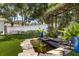 Beautiful backyard featuring a lush garden area with a charming pond and lush plants at 2105 Fosgate Dr, Winter Park, FL 32789