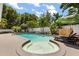 Backyard pool with spa, lounge chairs, and tropical landscaping at 2105 Fosgate Dr, Winter Park, FL 32789