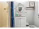 Cozy bathroom featuring a shower with yellow tile, a single sink, and a whimsical decor at 2105 Fosgate Dr, Winter Park, FL 32789