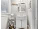 Clean bathroom featuring a sink, mirror, and neutral decor at 2105 Fosgate Dr, Winter Park, FL 32789