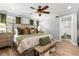 Comfortable bedroom featuring wood floors, a ceiling fan, and natural light at 2105 Fosgate Dr, Winter Park, FL 32789