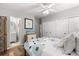 Bright bedroom with a ceiling fan, closet space and a view to an ensuite bathroom at 2105 Fosgate Dr, Winter Park, FL 32789
