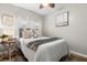 Cozy bedroom with a queen bed, soft linens, and nautical decor at 2105 Fosgate Dr, Winter Park, FL 32789