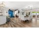 Spacious dining area with a wooden table, neutral chairs, and an open layout connecting to the kitchen and living room at 2105 Fosgate Dr, Winter Park, FL 32789