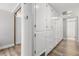 Hallway with white cabinetry and a view to a bathroom at 2105 Fosgate Dr, Winter Park, FL 32789