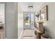Bright hallway with wood accents and door with sidelight at 2105 Fosgate Dr, Winter Park, FL 32789