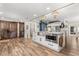 Kitchen island featuring stainless steel appliances, a marble countertop, and wood-look tile flooring at 2105 Fosgate Dr, Winter Park, FL 32789