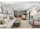 Comfortable living room with built-in shelving, a decorative fireplace, and a neutral color palette at 2105 Fosgate Dr, Winter Park, FL 32789