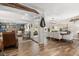 Open-concept living and dining area with wood-look tile flooring and seamless flow, perfect for entertaining at 2105 Fosgate Dr, Winter Park, FL 32789