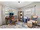 Well-lit office space with desk, storage, and charming decor at 2105 Fosgate Dr, Winter Park, FL 32789
