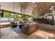 Inviting outdoor living area with bar, ample seating, and a view of the pool at 2105 Fosgate Dr, Winter Park, FL 32789