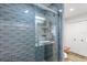 Modern shower with a glass door, subway tile, and a built-in shelf at 2105 Fosgate Dr, Winter Park, FL 32789