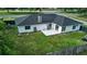 A large backyard, stone chimney, and a gray privacy fence surround this house at 211 Marion Oaks Ln, Ocala, FL 34473