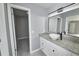 Bright bathroom featuring granite countertops with a vessel sink and tile floors at 211 Marion Oaks Ln, Ocala, FL 34473