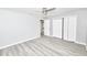 Bedroom featuring a closet with folding doors and wood-look flooring at 211 Marion Oaks Ln, Ocala, FL 34473