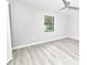 Bedroom featuring a ceiling fan, light gray walls, and wood-look flooring at 211 Marion Oaks Ln, Ocala, FL 34473